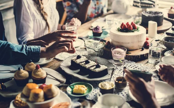 People celebrate birthday at table — Stock Photo, Image