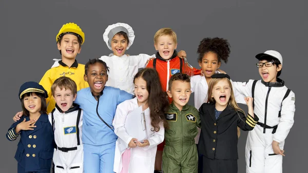 Niños con disfraces de diversas profesiones — Foto de Stock