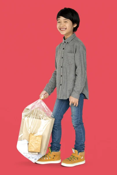 Boy with bag of paper garbage — Stock Photo, Image