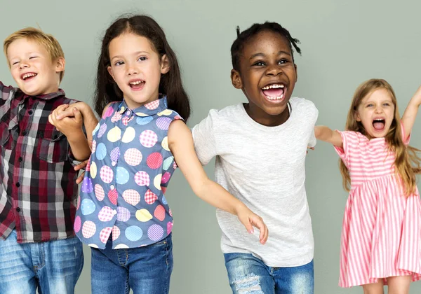 Multiethnic children holding hands — Stock Photo, Image