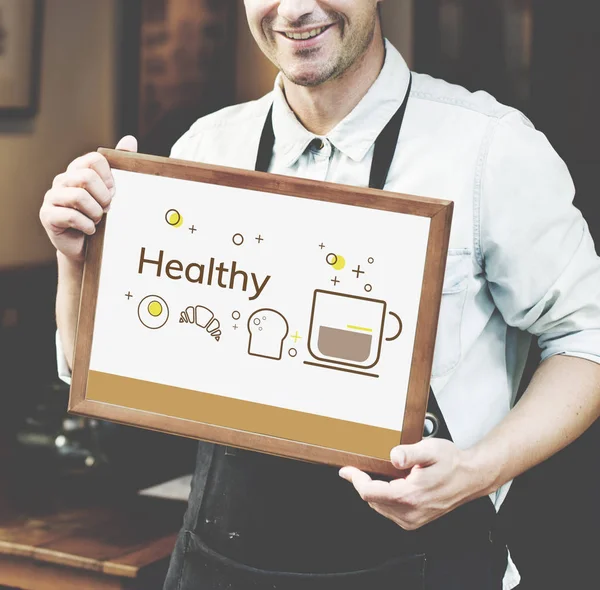 siyah önlük poster tutan adam