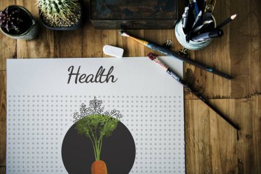 Masanın üzerinde albüm ve Boya fırçaları