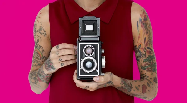 Woman holding retro photo camera — Stock Photo, Image