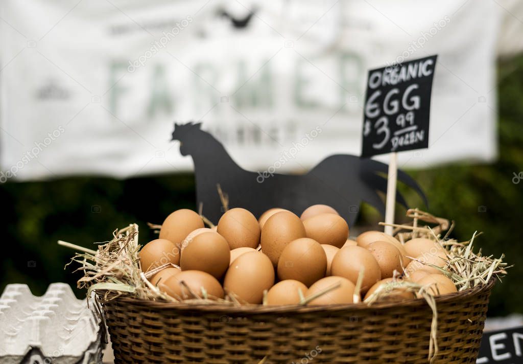 Rooster Eggs on Hay at Farmer Market