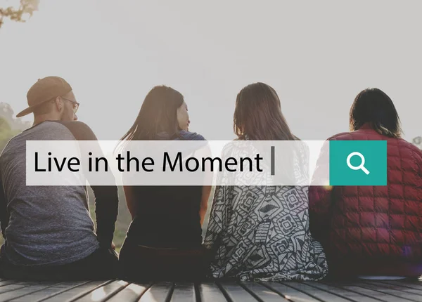 Young people sitting on wooden planks — Stock Photo, Image