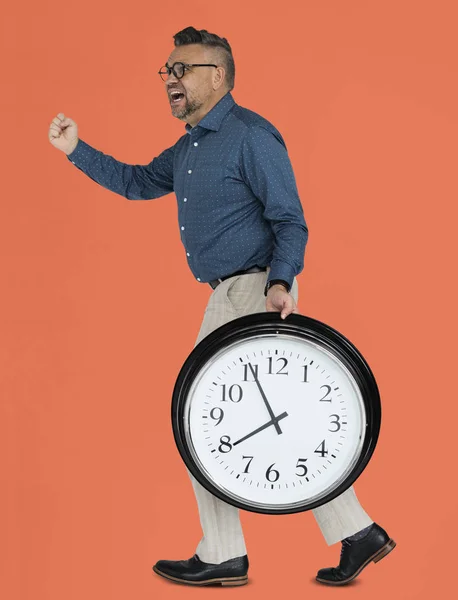 Hombre con reloj de pared —  Fotos de Stock