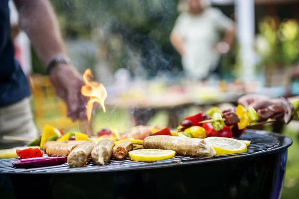 Charcoals grill with sausages and vegetables — Stock Photo, Image