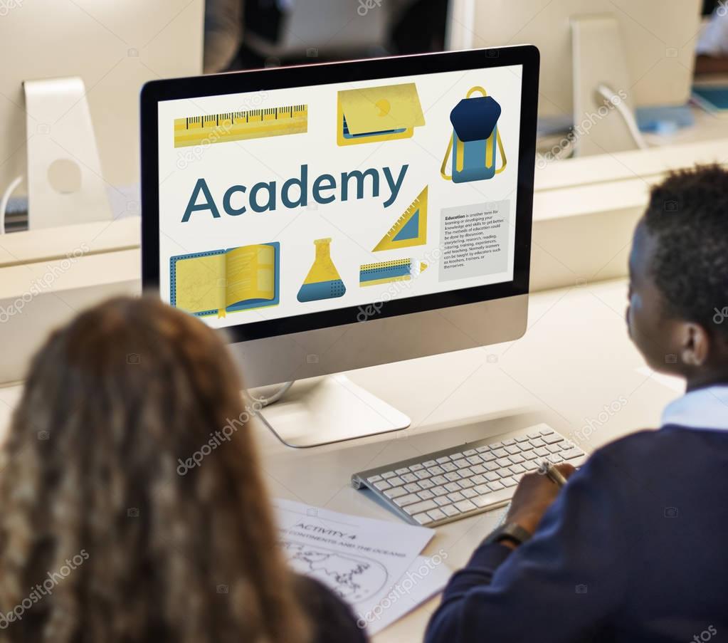 Boy and girl sitting and looking at monitor screen with title: Academy