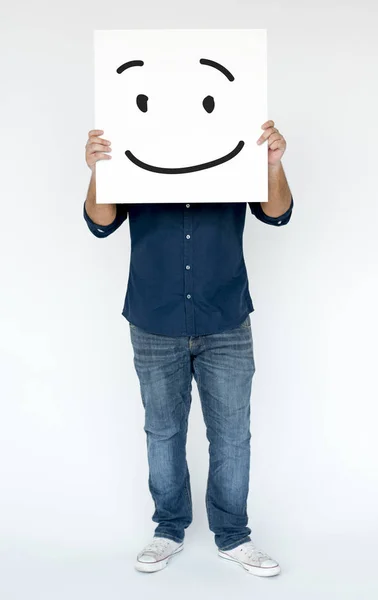 Homem segurando banner com rosto sorridente — Fotografia de Stock