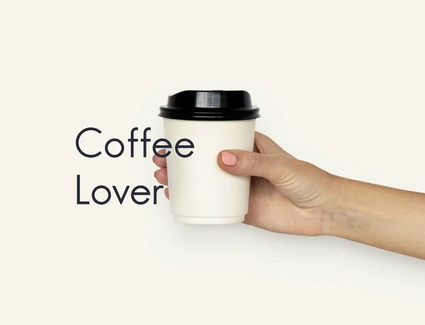 Рука тримає кавовий кухоль — стокове фото