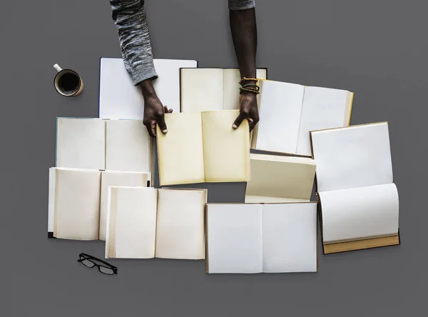 African person hands with books — Stock Photo, Image