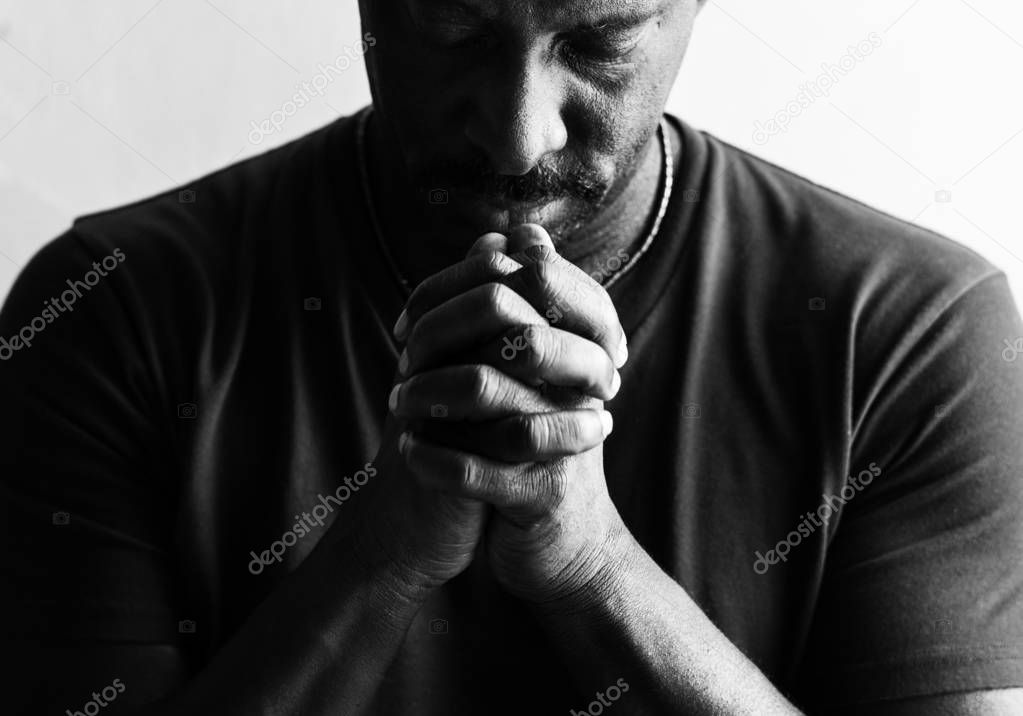 African man praying god