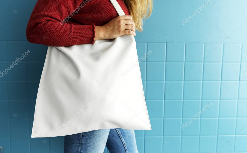 Closeup of woman with white tote bag, original photoset