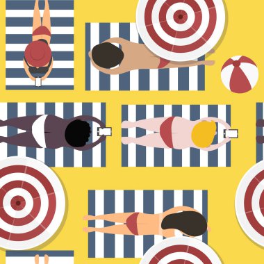 İnsanlar kumsalda güneşleniyor. 