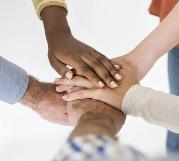 Pile of hands unity teamwork diverse people Royalty Free Stock Images