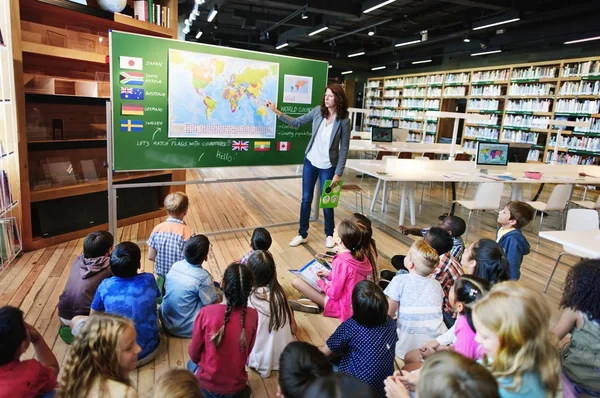 Group of diversity children at lesson in library, original photoset