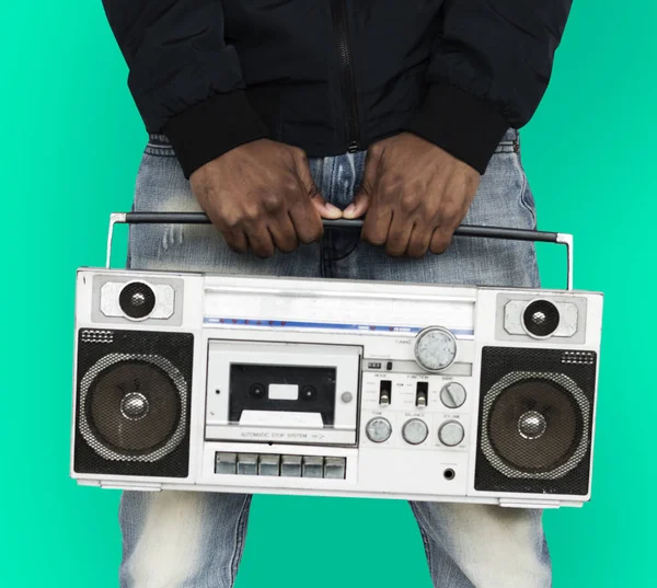 Emberi kéz, gazdaság boombox — Stock Fotó