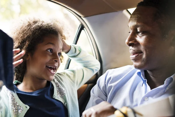 African father with daughter in car, original photoset