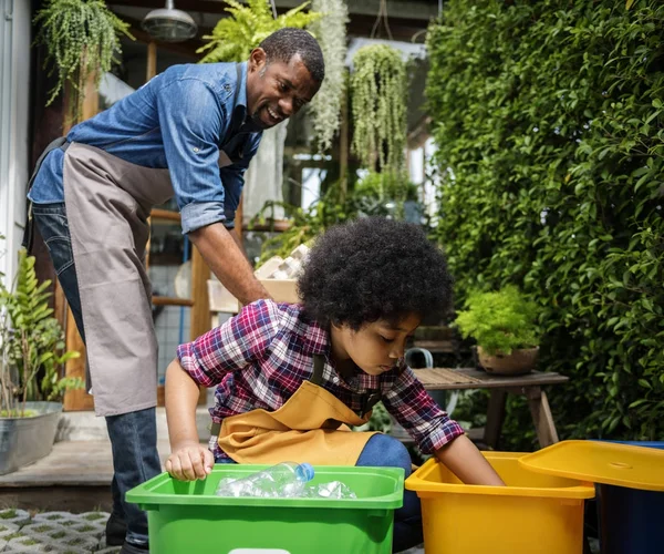 girl helping father clean garbage in containers, original photoset