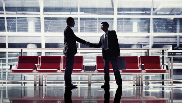 Business handshake in an airport, original photoset