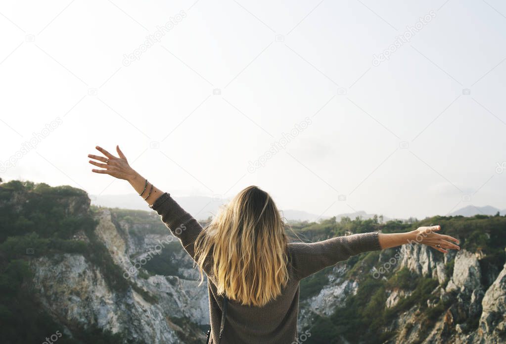 Carefree woman arms outstretched on the mountain, original photoset