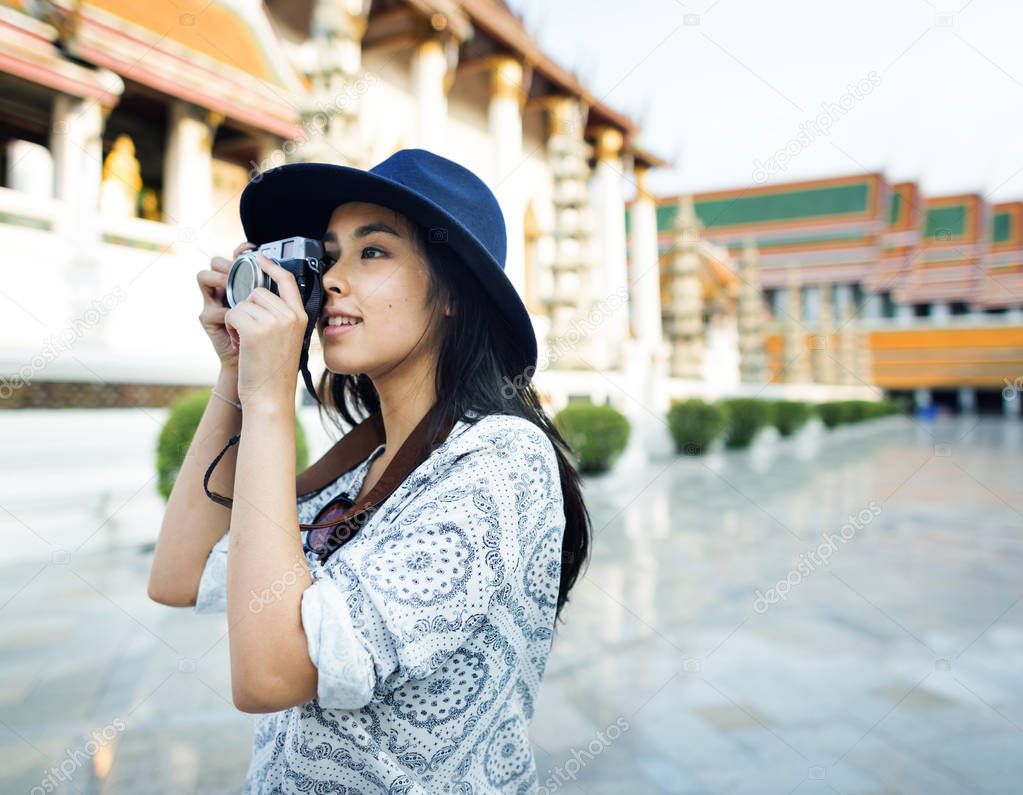 Asian woman in black hat