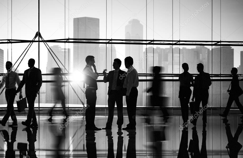 silhouettes of busy business people  