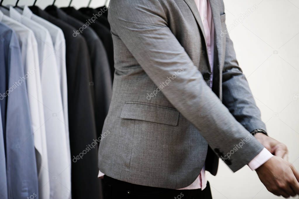 Man reconciling jacket in shop, original photoset