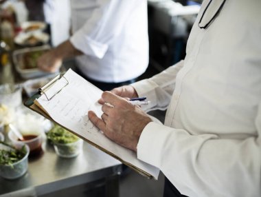 Kontrol yemek listesi liste, özgün photoset Şef el closeup