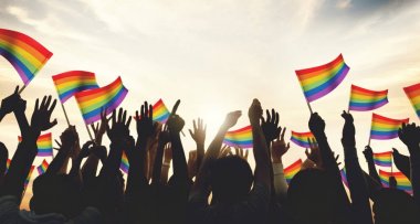 A crowd with LGBT rainbow flags clipart