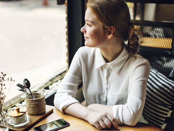 Woman looking in window