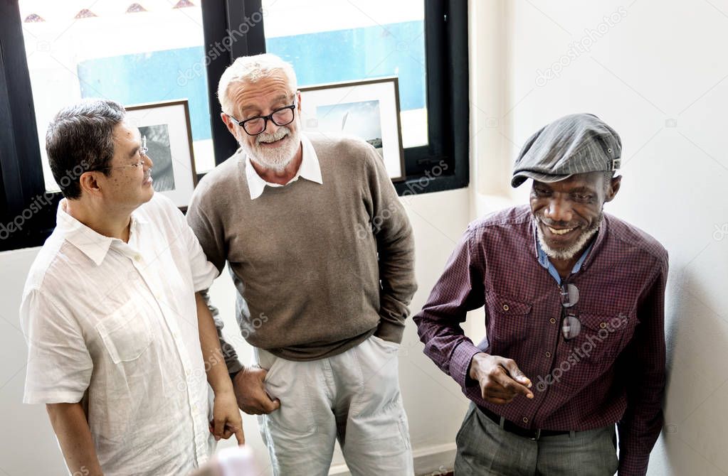 Three senior men discussing, original photoset