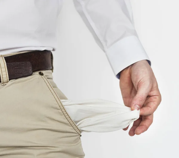 Masculino mostra vazio bolsos dinheiro menos — Fotografia de Stock