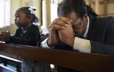 Religious man praying inside a church, original photoset clipart