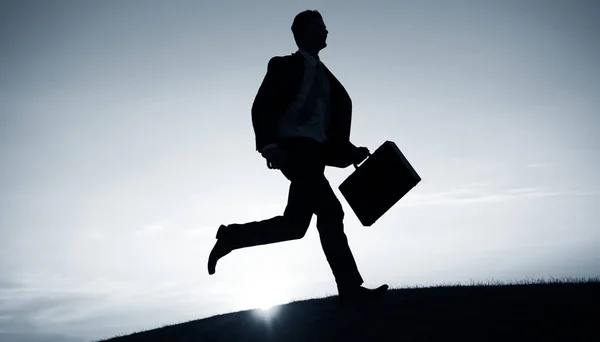 Businessman running with briefcase — Stock Photo, Image