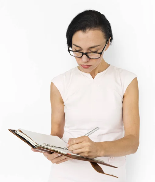 Businesswoman writing in notebook — Stock Photo, Image