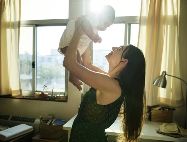 Mother Holding Newborn Baby Rised Hands Front Window Original Photoset — Stock Photo, Image