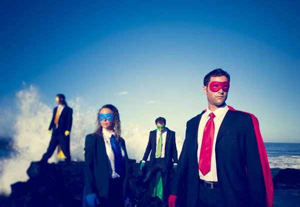 Business superheroes on beach — Stock Photo, Image