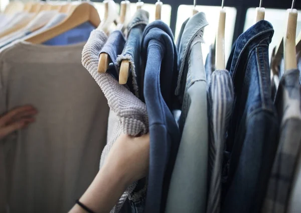 stock image woman choosing clothes in fashion store, original photoset