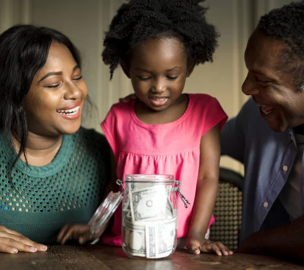 Parents teaching their daughter on how to save money, original photoset