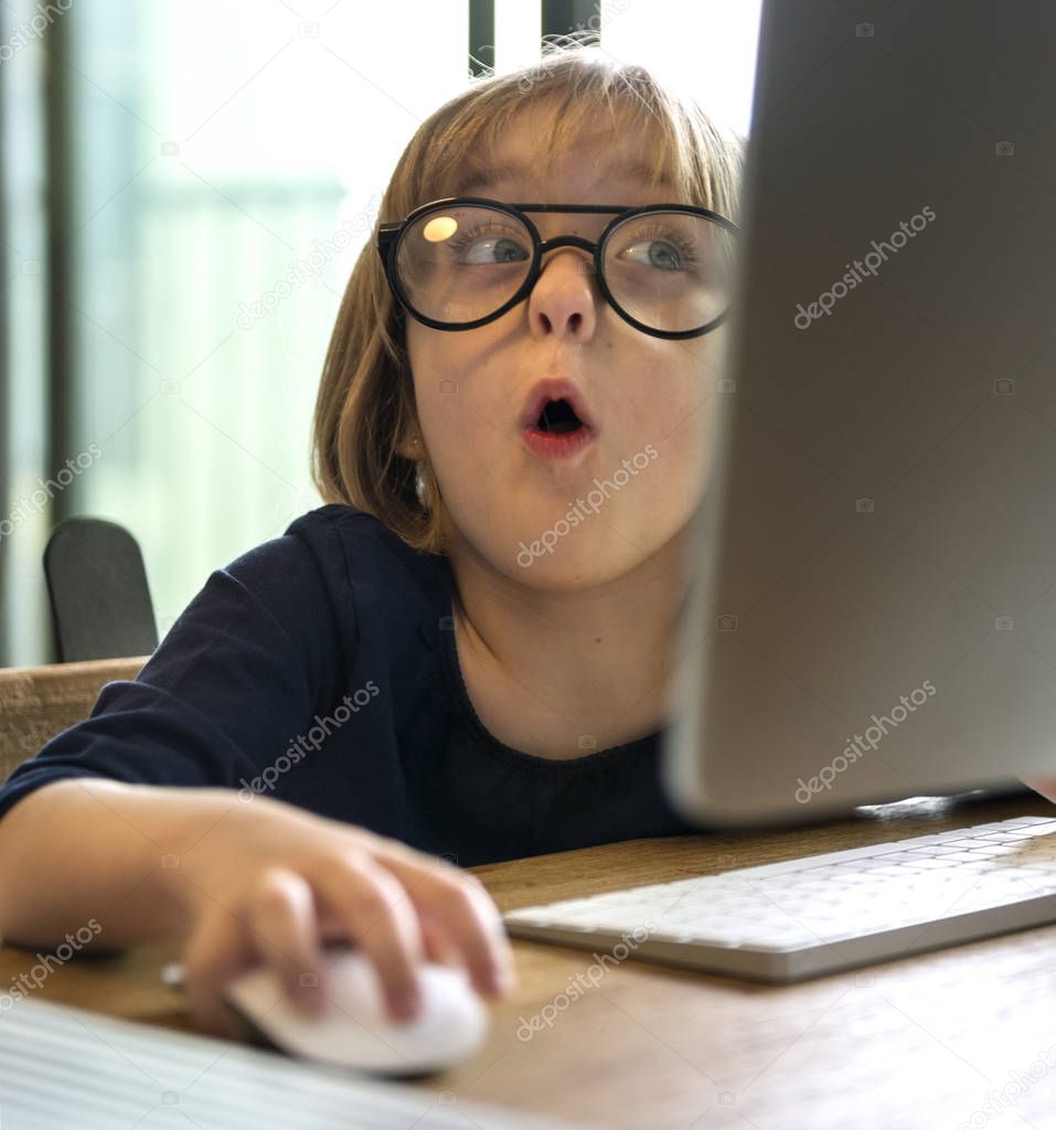 little girl using computer, technology and network concept, original photoset