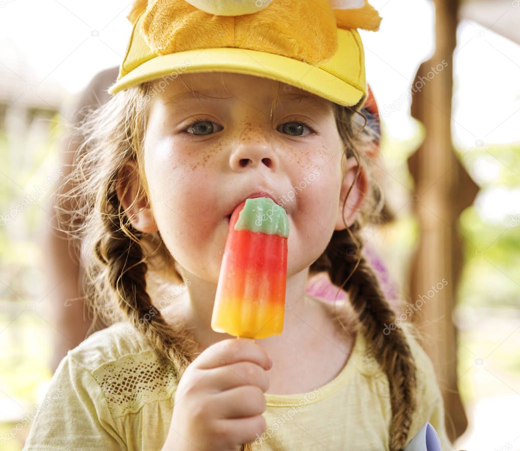 Young caucasian girl eating ice cream, original photoset