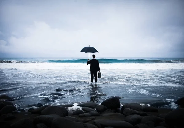 Lonely Businessman with umbrella — Stock Photo, Image