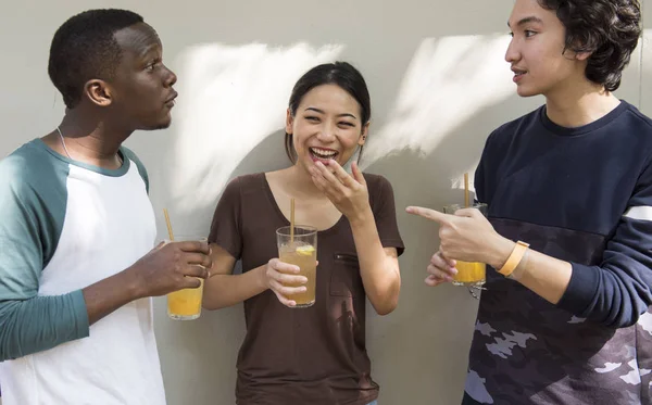 Friends students drinking juice Royalty Free Stock Images