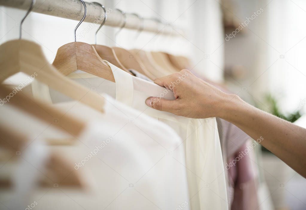 Woman checking out clothes, original photoset