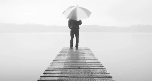 Lonely Businessman with umbrella — Stock Photo, Image