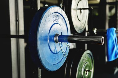 focus on various barbells in gym clipart