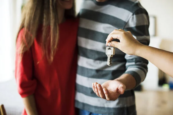 Couple Bought New House Closeup Hand Giving Key Couple — Stock Photo, Image
