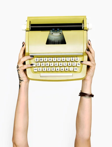 Hand Holding Golden Typewriter Machine — Stock Photo, Image