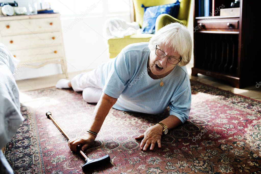 Elderly woman felling on the floor